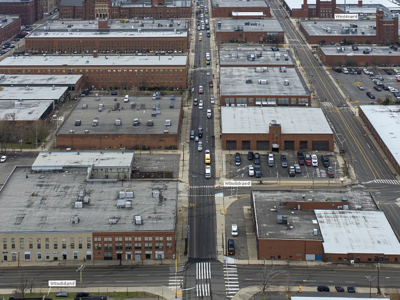 Aerial view of Detroit Woodward Avenue industrial corridor showing mix of manufacturing and urban landscape